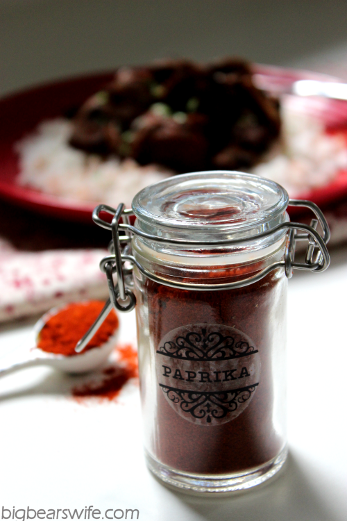 Paprika Spice jar with Paprika Steak and Rice in background