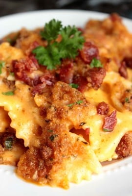 Bacon Beer Macaroni and Cheese is bowtie pasta that's tossed with a creamy beer cheese sauce and then baked until golden brown and bubbly.