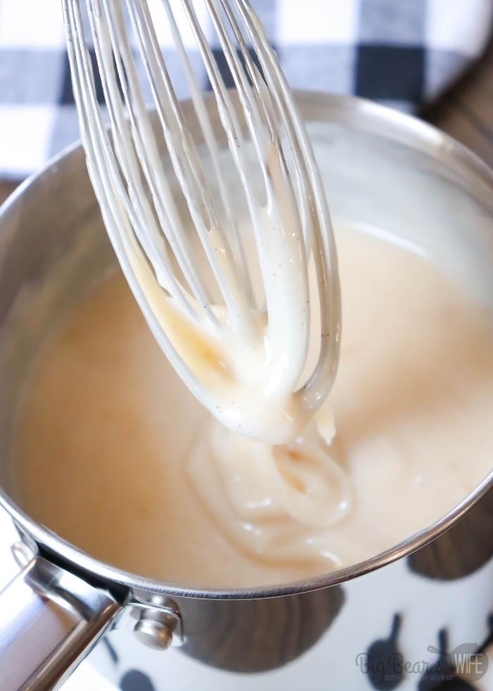 Silver whisk in Jack Daniels cream sauce