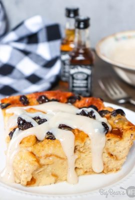 Slice of Jack Daniels Bread Pudding with raisins on a white plate (2)