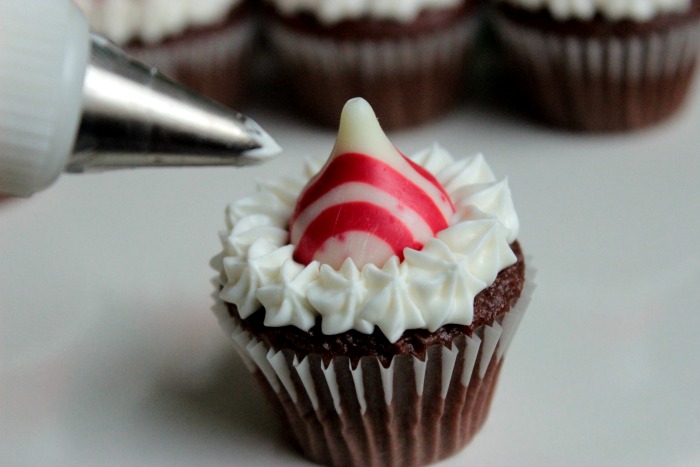 Steps to make Mini Santa Hat Cupcakes - with Candy Cane Kiss Centers