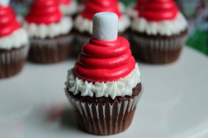 Mini Santa Hat Cupcakes - with Candy Cane Kiss Centers! HO HO HO! A Mini Santa Hat Cupcake!
