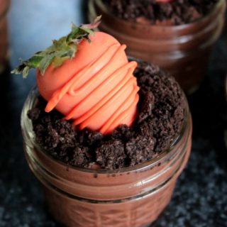 Chocolate Covered Strawberry Carrots - These cute spring dessert pudding cups are topped with easy to make Chocolate Covered Strawberry Carrots! They're the perfect dessert for celebrating Easter or Springtime! 