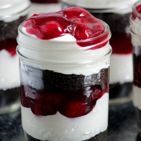 Layers of chocolate cookies, cherry pie filling and no bake cheesecake filling make up these super easy Chocolate Cherry Cheesecake Parfaits for dessert! 