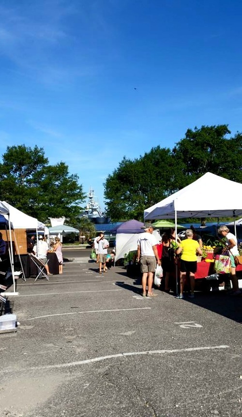 The Riverfront Farmer's Market with the USS North Carolina Battleship in the background
