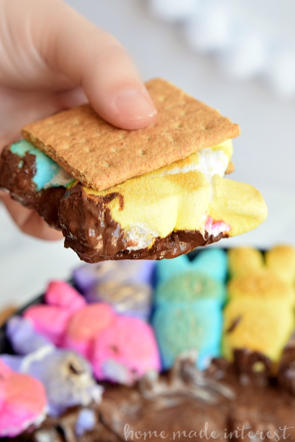 This easy Easter dessert recipe is made with chocolate, peanut butter, and bunny rabbit peeps, toasted up into an ooey gooey s’mores dip.