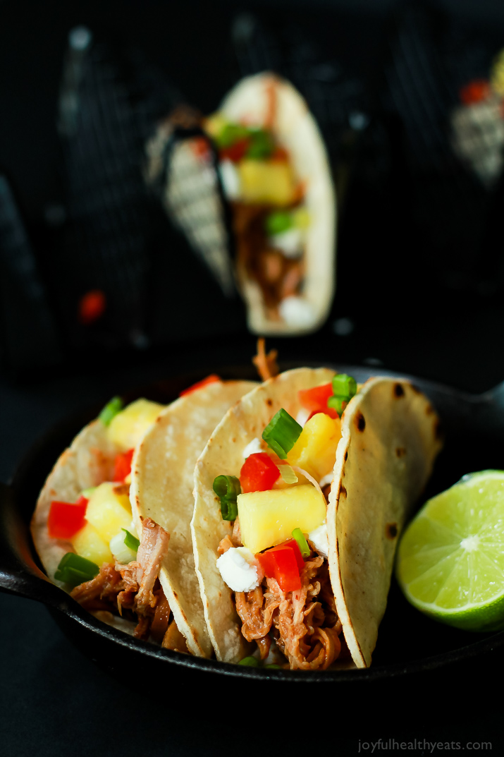 An easy Crock Pot Recipe your family will love! Hawaiian Pork Tacos filled with sweet pulled pork, fresh pineapple, red peppers, and goat cheese for a fun twist!! |joyfulhealthyeats.com #recipes