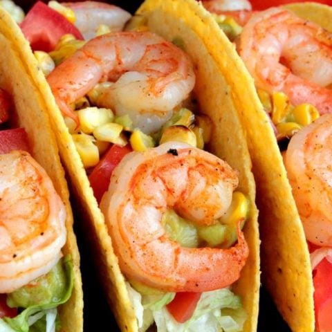 Easy Shrimp and Grilled Corn Tacos that pretty much scream summer! Grilled corn, seasoned shrimp and your favorite fillings make for one perfect taco meal!