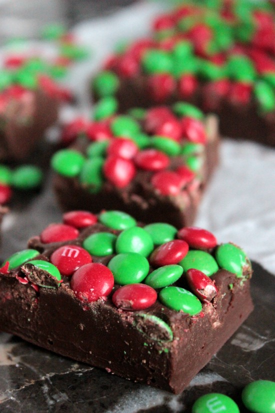 Three Ingredient Christmas M&M Fudge - Pack up a few trays of this Three Ingredient Christmas M&M Fudge into cute little Christmas tins and hand them out to friends and family this holiday season! This fudge is so simple to make that you'll want to make it for every holiday!