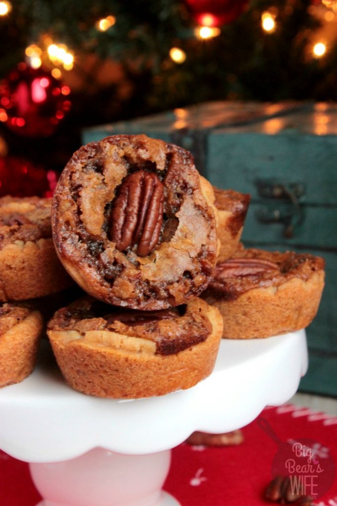 Pecan Pie Cookie Cups - These Pecan Pie Cookie Cups have a sweet pecan pie filling baked inside of a sugar cookie crust to create the perfect mini pecan pie dessert for your next holiday party!