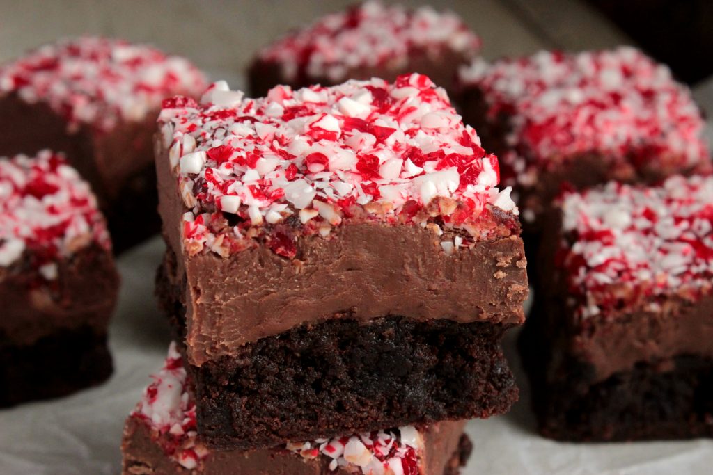Peppermint Fudge Topped Brownies - Chocolate Fudge Brownies topped with a thick layer of fudge with a layer of crushed peppermint candy canes sprinkled on top. - I love making these for gifts and Holiday parties!