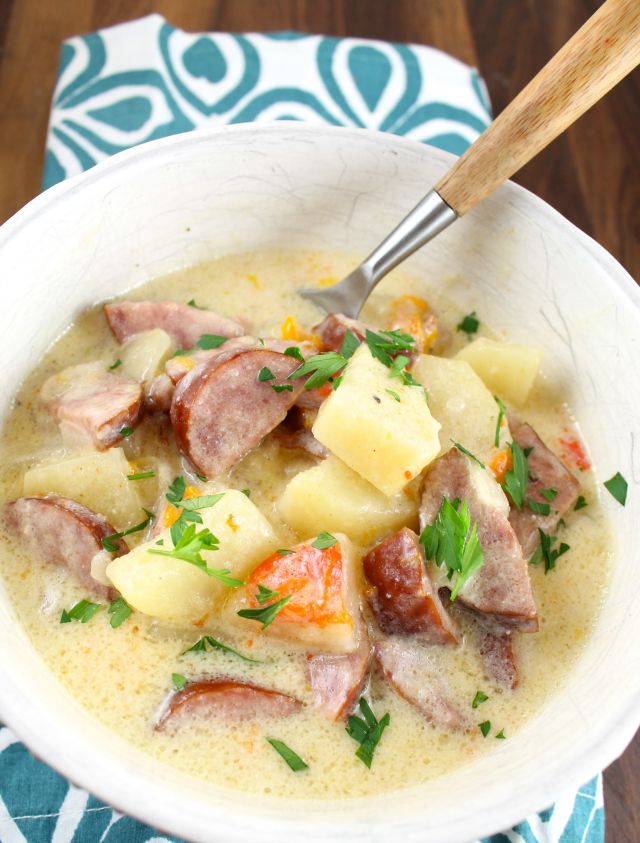 Comfort food in a bowl! Slow Cooker Cheesy Smoked Sausage and Idaho Potato Soup Recipe from Miss in the Kitchen