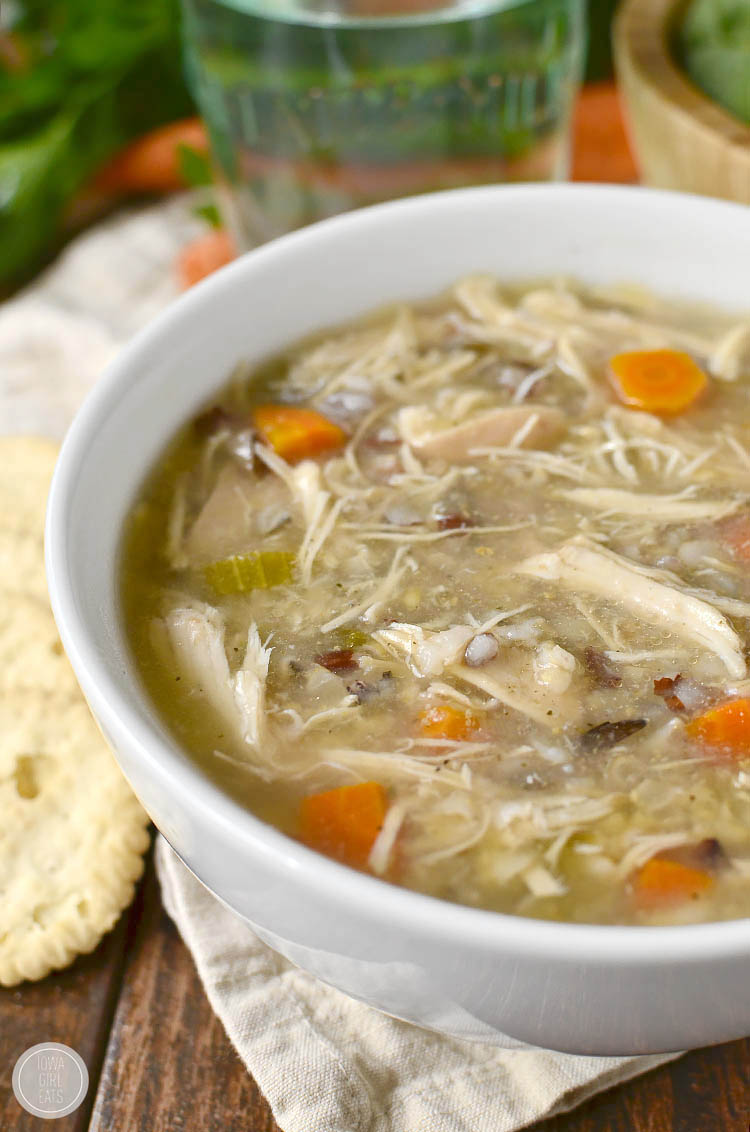 Crock Pot Chicken and Wild Rice Soup could not be simpler nor more comforting. Simply add fridge and pantry staples into the crock pot then push "on"! | iowagirleats.com