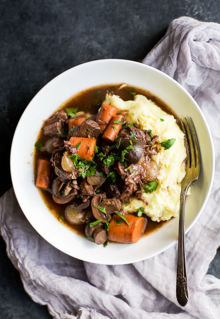 Channel your inner Julia Child with this easy Beef Bourguignon! A classic Beef Bourguignon recipe with a few tweaks but the kicker is this recipe is made in a slow cooker! | joyfulhealthyeats.com