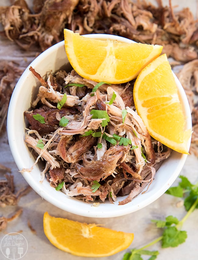 Slow Cooker Pork Carnitas - These deliciously flavored pork carnitas are cooked to perfection in the slow cooker for several hours. Then cooked on the skillet to get that perfect crunch while keeping the meat juicy! Great plain or eaten on tacos!