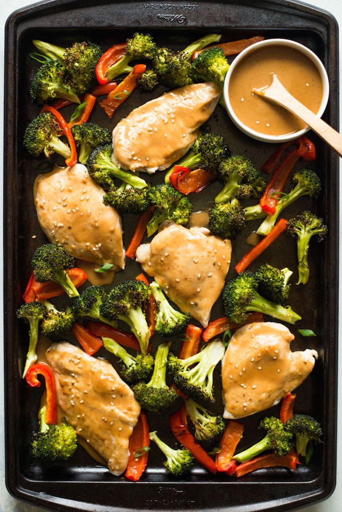 This easy Sheet Pan Chicken and Vegetables is a quick, healthy dinner recipe. Top it with a flavorful peanut sauce and the whole family will love it!