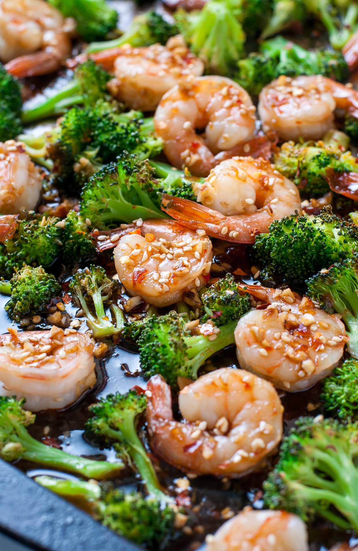 Flavorful roasted broccoli and tender, juicy shrimp join forces in this super easy Sheet Pan Roasted Honey Garlic Shrimp and Broccoli. This one pan wonder makes a great fuss-free weeknight dinner!