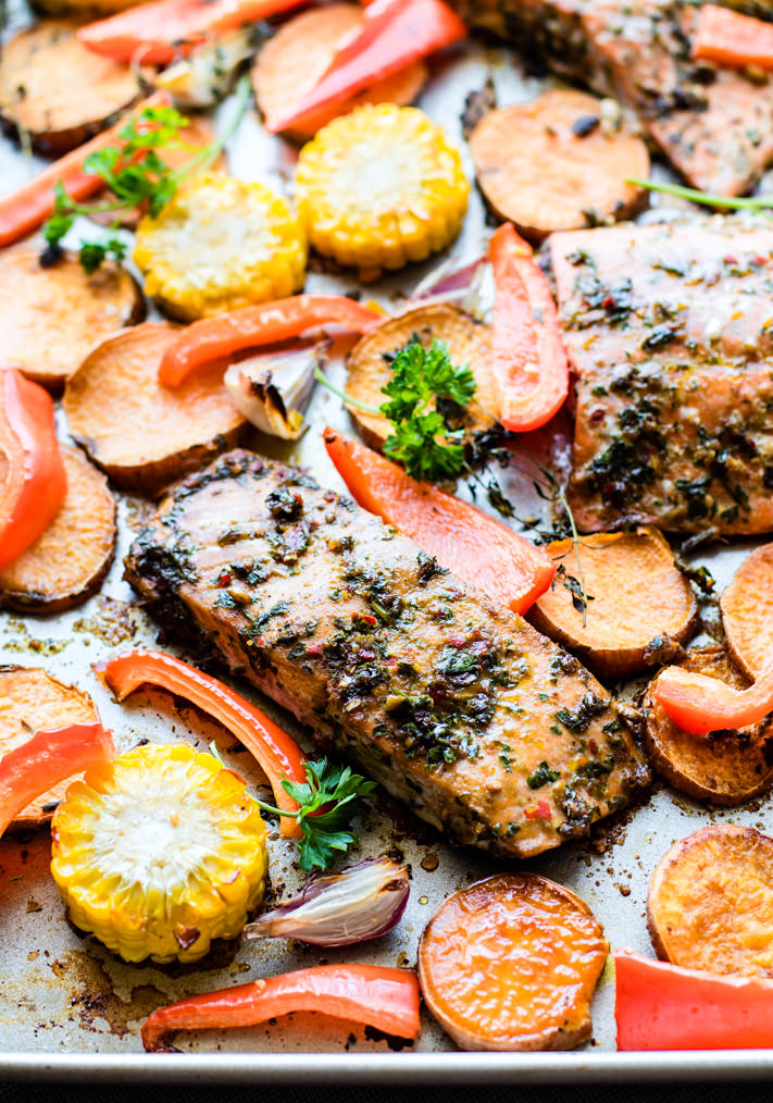 Easy Sheet Pan Jerk Salmon with Veggies! Flavorful Jerk salmon recipe with seasonal veggies baked all on one sheet pan. A wholesome protein packed one pan meal that nourishes the whole family! Did I mention EASY cleanup? Yes!