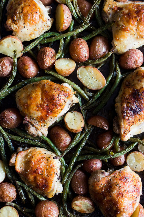 This sheet pan chicken and potato dinner with green beans is ready in under an hour and devoured in just minutes. You'll love how easy this dinner is to throw together and it will be sure to impress even the pickiest of eaters!