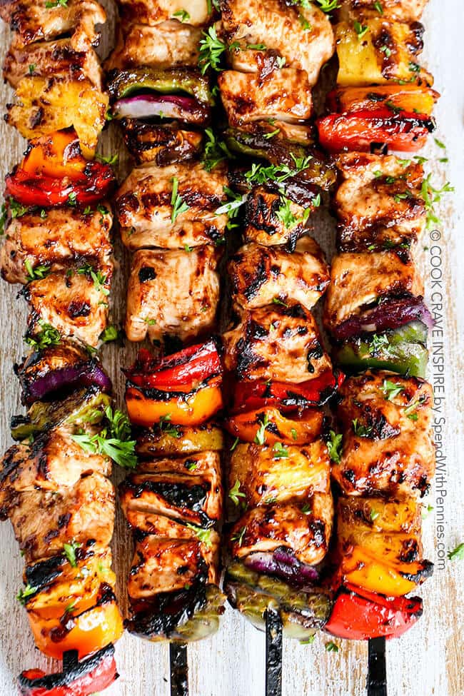 Grilled Hawaiian Chicken Kabobs. Tender juicy chicken layered with a rainbow of veggies in a tangy Pineapple Honey BBQ Sauce. The perfect quick & easy summer meal!