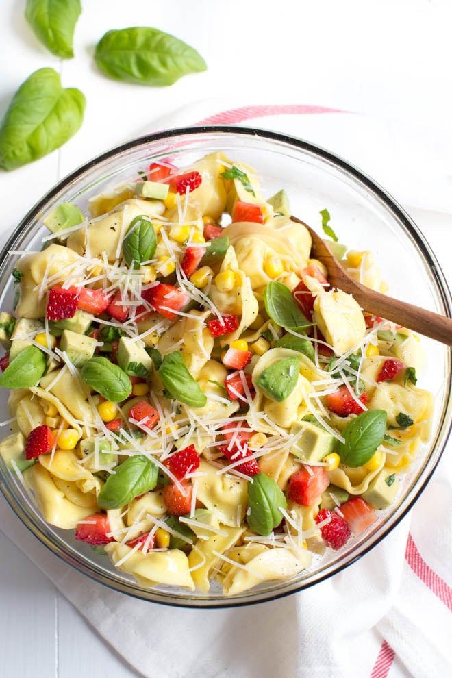 Strawberry, Corn and Avocado Tortellini Salad is a refreshing summer salad made with strawberries, corn, avocado, basil, Parmesan cheese and a simple balsamic dressing! 