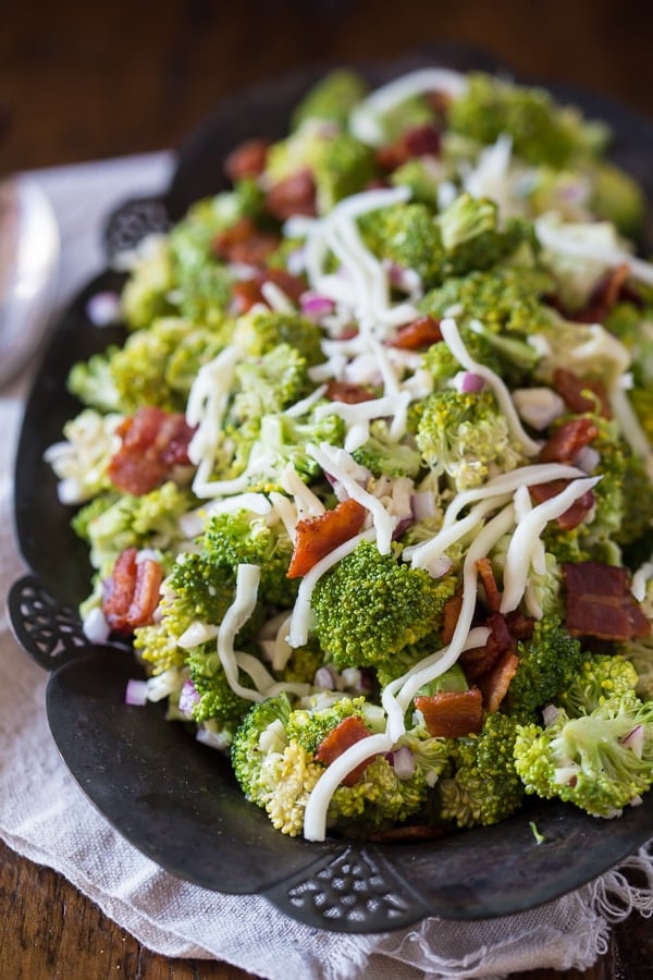 This tangy broccoli bacon salad is creamy, crunchy and packed full of flavor. A delicious mixture of broccoli, bacon, red onion, mozzarella cheese and creamy homemade dressing. Say hello to your new favorite salad!