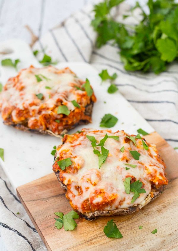 This Chicken Parmesan Stuffed Portobello Mushrooms recipe is a quick, healthy, and easy meal for busy weeknights. You could even use rotisserie chicken! Get the stuffed mushroom recipe on RachelCooks.com!