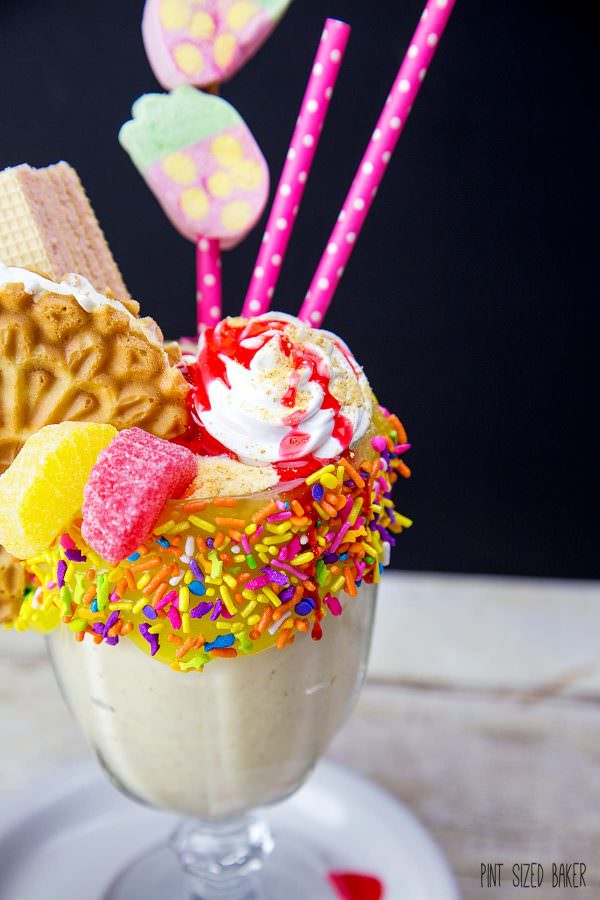 This Lemon Meringue Pie Milkshake is topped with a lemon ice cream sandwich, strawberry wafer cookies, fruit gummies, marshmallow cream, and a fun strawberry marshmallow decoration. The kids loved it!