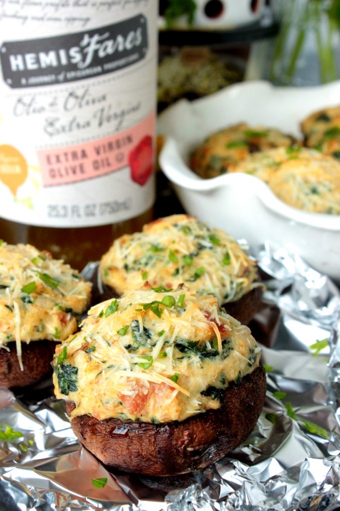 Crab Stuffed Mushrooms - These Crab Stuffed Mushrooms are filled with an easy cream cheese, crab and spinach filling! PS. there are NO breadcrumbs in this recipe!