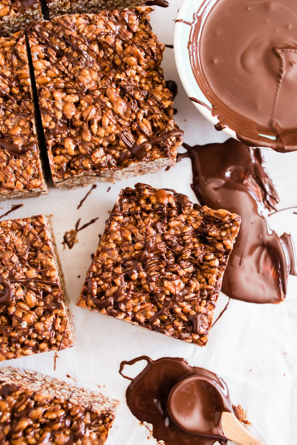 These peanut butter Nutella Rice Krispie treats are extra large, extra marshmallowy and crazy delicious! You're going to love how easy these treats are to make and they are ready in just 20 minutes! Plus to top them off I drizzled them with dark chocolate.