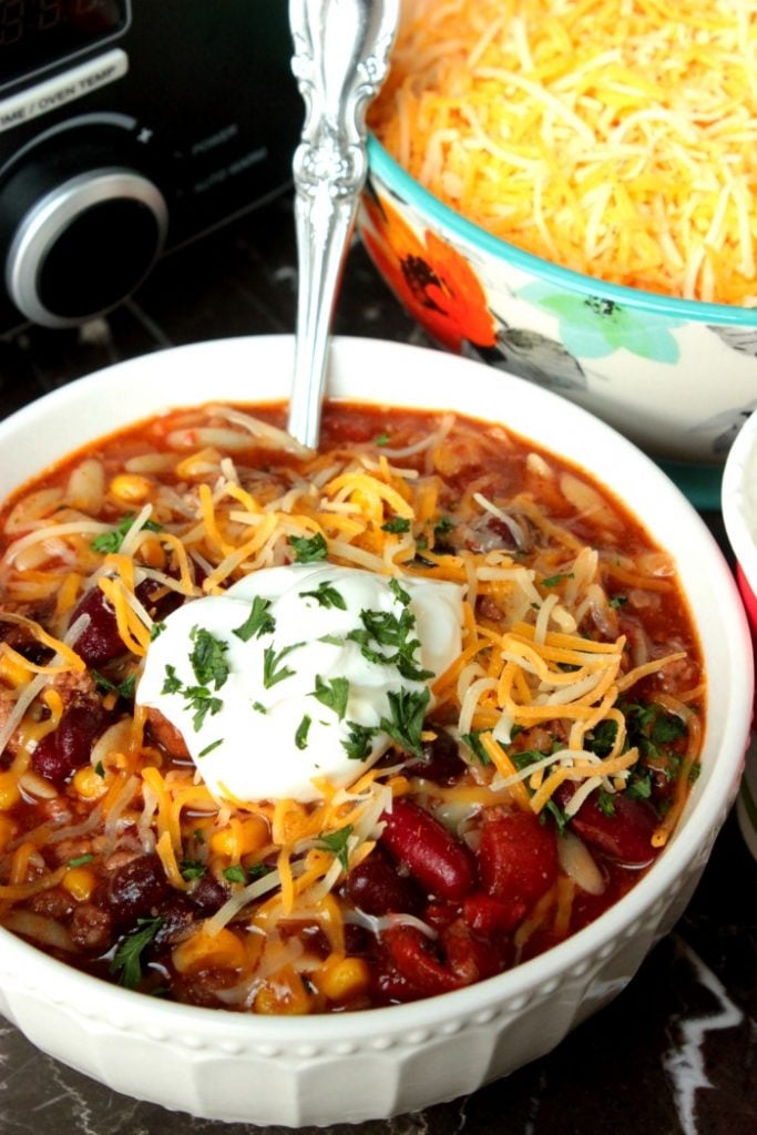 Slow Cooker Taco Soup - A few easy to grab ingredients and a slow cooker are all you need to make this tasty Slow Cooker Taco Soup for dinner! Serve it as is or top with sour cream and cheese!!!