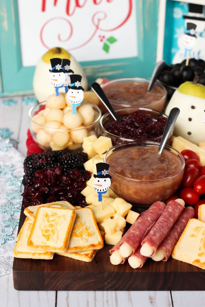 Snowman Holiday Cheeseboard with Vanilla Pear Butter - Perfect for Christmas or anytime during the winter, this Holiday Cheeseboard has got a little snowman theme and it's filled with tons of tasty treats to keep all of your party guests happy!