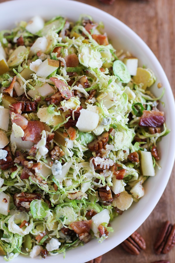 Brussels Sprout Chopped Salad with candied pecans, pears, blue cheese, bacon, and warm maple-bacon vinaigrette