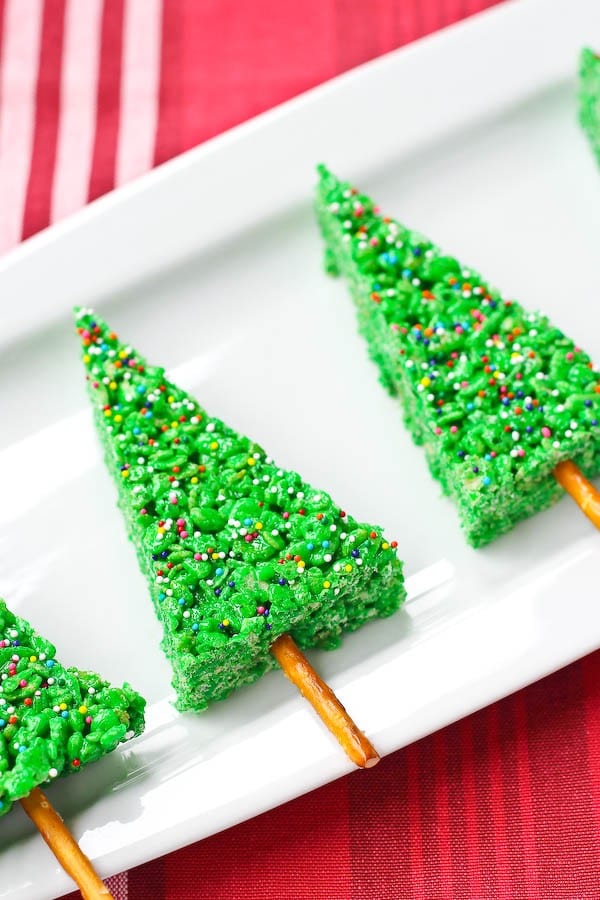 Christmas Tree Rice Krispie Treats are SO simple to make and kids adore the fun shape and color. If you’re scrambling for a last minute holiday treat, these are it! Get the easy kid-friendly recipe on RachelCooks.com!