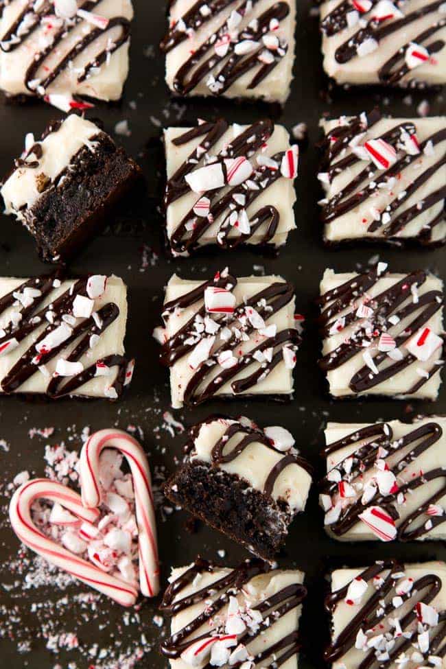 These rich dark chocolate Peppermint Brownies topped with cream cheese frosting, ganache, and candy cane are the perfect dessert to indulge in with your friends and family this Christmas.