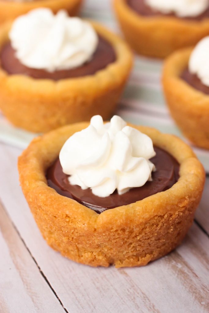 Chocolate Cream Pie Cookie Cups with whipped cream