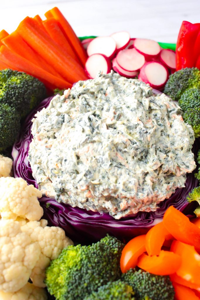 Ranch Spinach Dip with various raw vegetables 