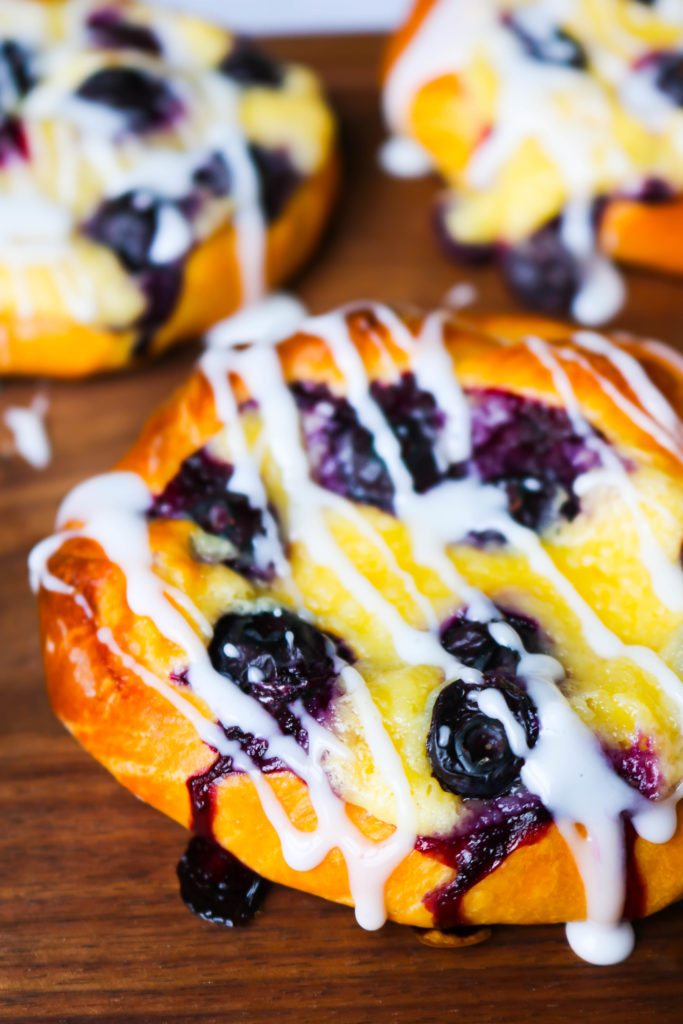 Homemade Blueberry Cream Cheese Danishes - While I love a good shortcut when it comes to baking, Homemade Blueberry Cream Cheese Danishes from scratch are 100% worth it! They're filled with a cream cheese filling and topped with fresh summer blueberries! 