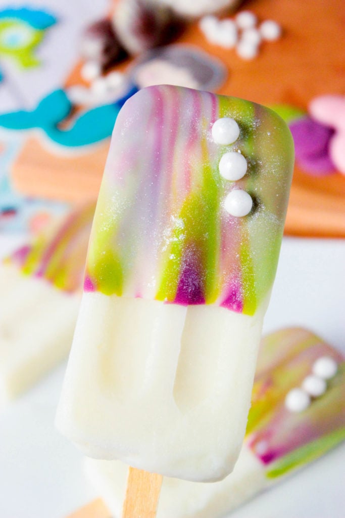 Mermaid Magic Shell (Mermaid Popsicles) - Ready for a magical summer dessert? These Mermaid Popsicles with homemade Mermaid Magic Shell are the answer! You'll love the shimmer and magical swirls that these mermaid pops have! 