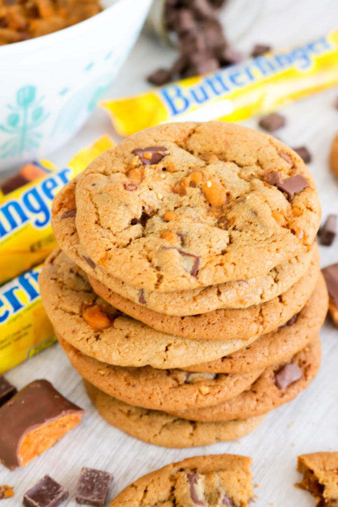 These Chocolate Chunk Butterfinger Cookies are soft and chewy cookies packed with chocolate chunks and chopped Butterfinger Candy Bars. One bite of these and you’ll feel like a kid in a candy store!!