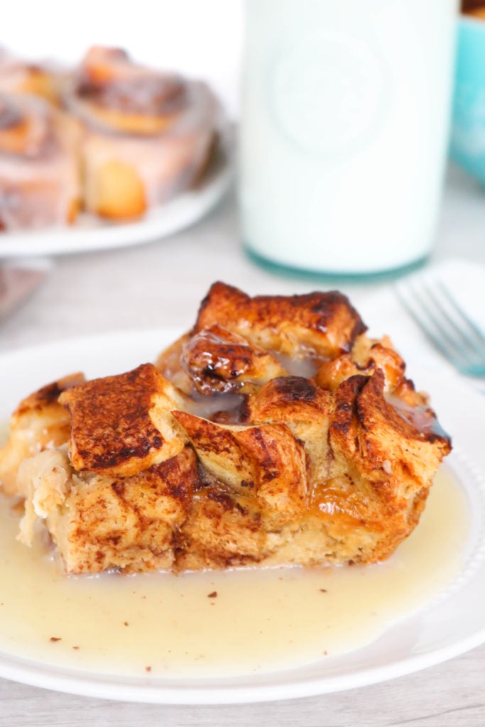 Cinnamon Roll Bread Pudding - Create an indulgent treat by replacing traditional french bread with cinnamon rolls in this Cinnamon Roll Bread Pudding. Warm, gooey, cinnamon roll goodness is taken over the top with the addition of vanilla custard and a cinnamon infused glaze. 