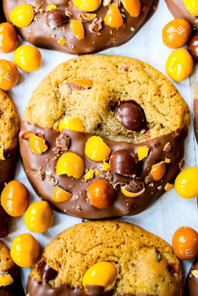 These homemade Chocolate Dipped English Toffee Peanut M&M Cookies are incredibly soft, packed with chocolate chip, dipped in melted chocolate and feature the new English Toffee M&Ms!
