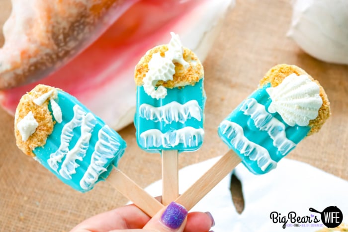 Seashell Beach Cakesicles - These fun SeaShell Beach Cakesicles look like ice cream pops and taste like cake pops! Cake and frosting inside a candy coating decorated to look like the beach seems like the perfect summer dessert! 