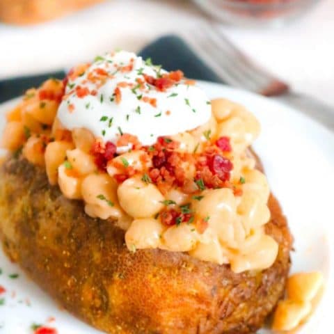 Calling all carb lovers!!! These Loaded Mac and Cheese Stuffed Baked Potatoes might be the best stuffed baked potatoes ever. Homemade Mac and cheese stuffed into a freshly baked potato is a carb lover’s dream come true!