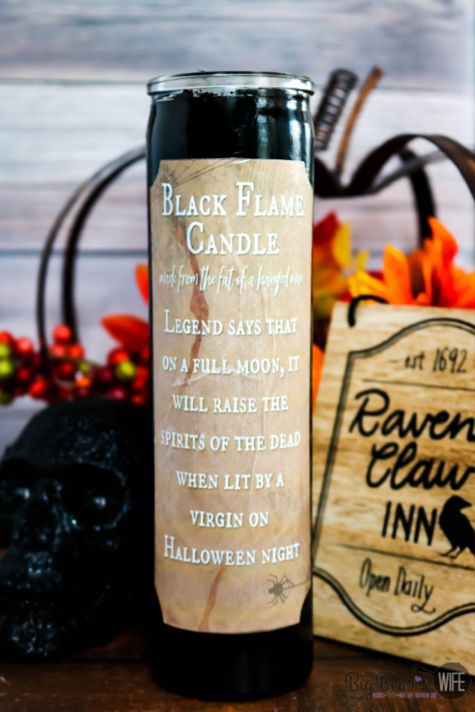 Dollar Store DIY Black Flame Candle - If you love the movie "Hocus Pocus" you need to stop what you're doing now and run to the Dollar Tree because I'm going to show you how to make your own Dollar Store DIY Black Flame Candle!