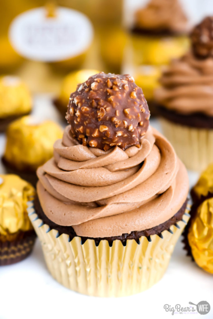 Ferrero Rocher Cupcakes - Love Ferrero Rocher Candies? Then these Ferrero Rocher Cupcakes are going to be your new favorite dessert! Homemade Chocolate cupcakes with a chocolate hazelnut frosting is topped with a Ferrero Rocher Chocolate and dressed in a gold cupcake liner for the most elegant cupcake ever. 