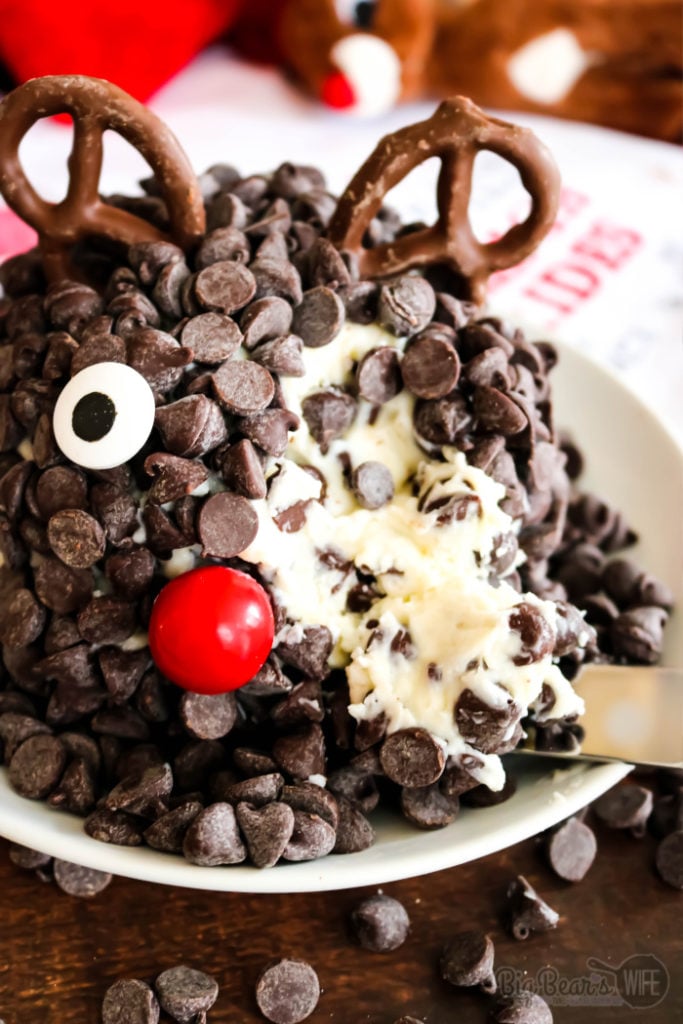 Chocolate Chip Rudolph Cheese Ball - Ready to spread some joy? Literally? This Chocolate Chip Rudolph Cheese Ball is the perfect joyful holiday dessert! A festive dessert cheeseball decorated to look like Rudolph the Red-Nosed Reindeer.