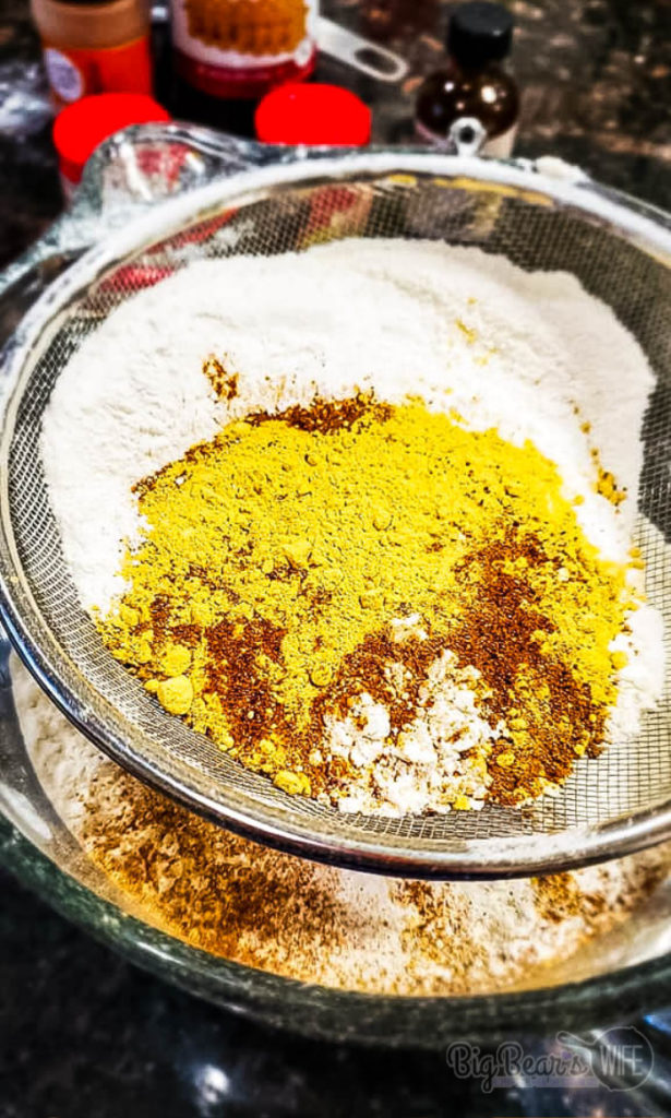 Sifting flour and spices for cookies