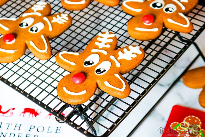 Reindeer Gingerbread Men Cookies - Upside Down Gingerbread Man Reindeer Cookies - These adorable Reindeer Gingerbread Cookies are made using an Upside Down Gingerbread Man cookie cutter, royal icing and a red chocolate candy for the nose! 