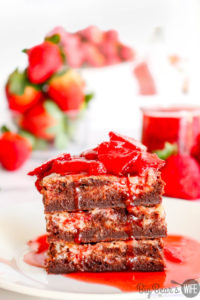 Strawberry Cream Cheese Brownies - Strawberry Cream Cheese Brownies are ooey gooey homemade brownies topped with strawberry cheesecake baked into the top of each bite. They are delicious as is just out of the oven, but to take them over the top, serve them with a Homemade Strawberry Sauce for a decadent chocolate and strawberry treat!